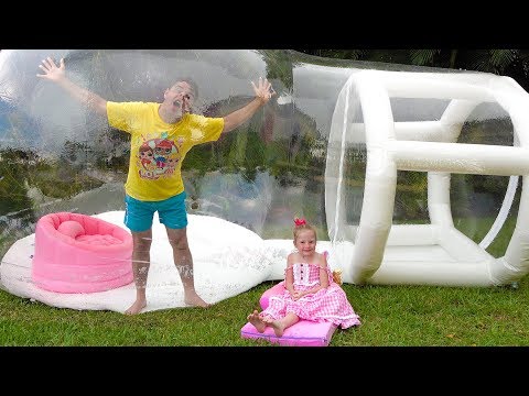 Nastya and dad play with a huge inflatable ball