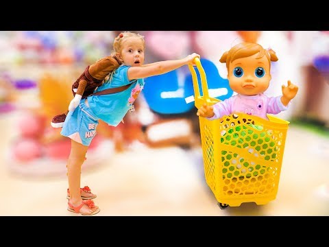 Nastya and baby doll doing shopping - song for kids Nursery Rhyme by Nastya at the candy shop