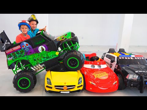 Vlad and Nikita ride on toy monster truck and goes through the cars for kids