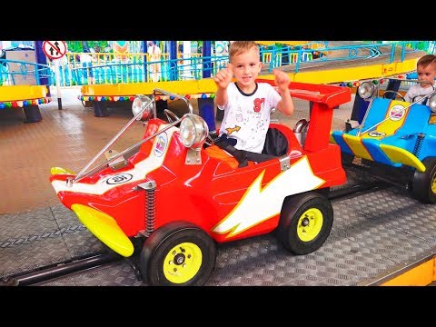 Vlad and Nikita play with Mom at the Amusement Park Family Fun