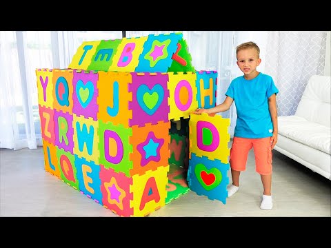 Vlad and Nikita play and build colored Playhouse