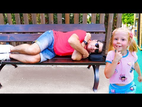 Nastya and sleeping dad are having fun in an amusement park